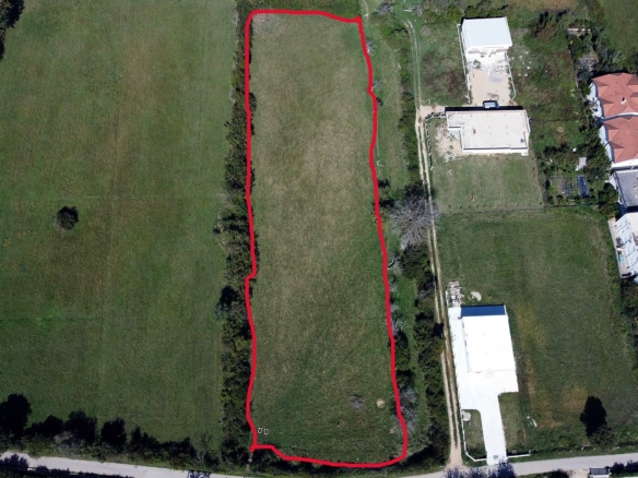 Prime rectangular land plot in Ulcinj, Montenegro&mdash;outlined in red, near homes & roads. Ideal investment via immobilien.ekosphere.me by Ekosphere.