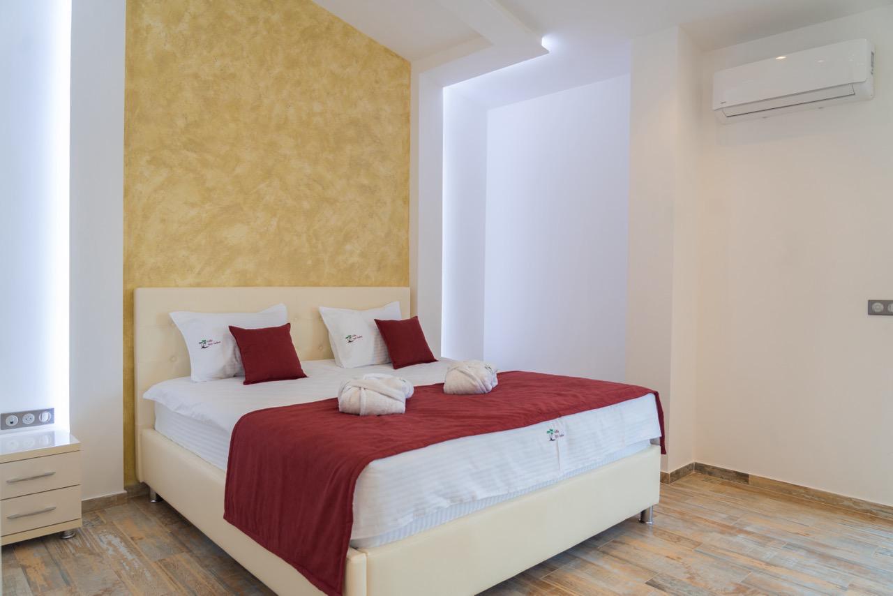 Bright Ulcinj property with wood floors, stylish bed, and modern decor&mdash;exclusive listing by immobilien.ekosphere.me, Ekosphere doo.