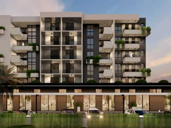 Modern Ulcinj apartment building with balconies, lush terraces, glass-fronted ground units. Invest via immobilien.ekosphere.me (ekosphere doo).