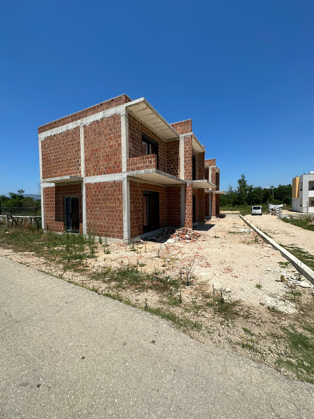 Invest in Ulcinj: Two-story brick property under construction on prime land, listed on immobilien.ekosphere.me by ekosphere doo.