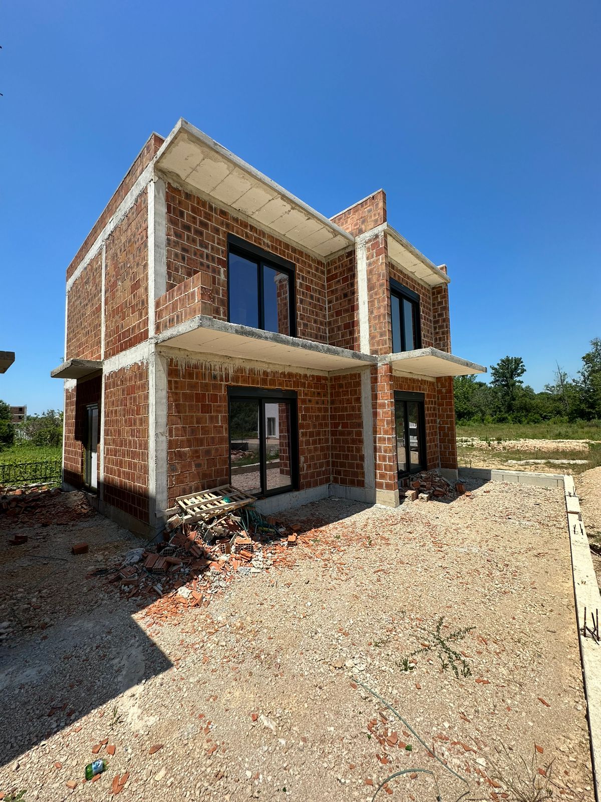 Modern two-story house under construction in Ulcinj, Montenegro&mdash;prime real estate investment from ekosphere doo via immobilien.ekosphere.me.