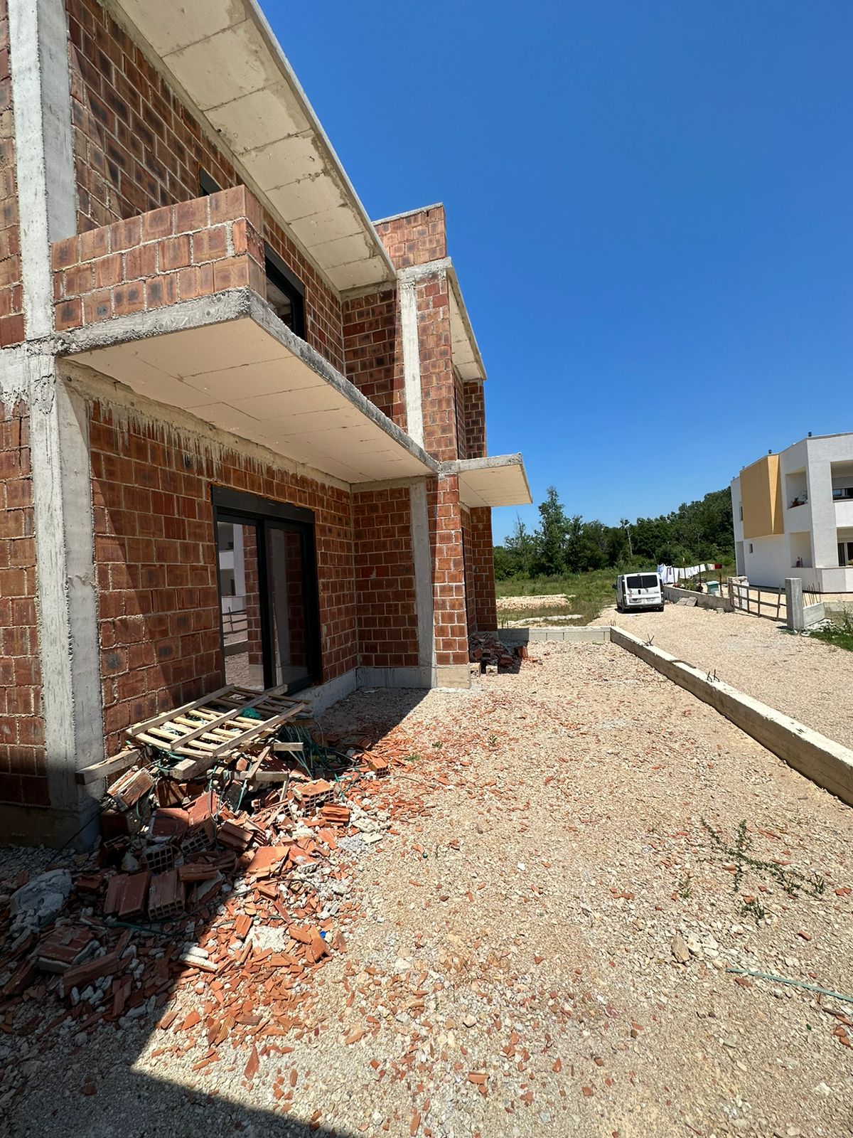 Prime investment opportunity: Partially built brick property in Ulcinj, Montenegro. Clear sky, easy access. Montenegro-listings.me by ekosphere doo.