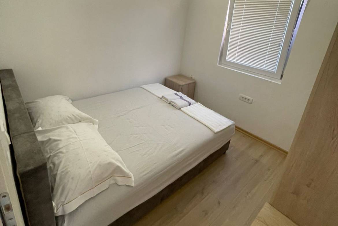 Charming Ulcinj bedroom with double bed, bright floors, and modern touches&mdash;ideal Montenegro real estate by immobilien.ekosphere.me/ekosphere.