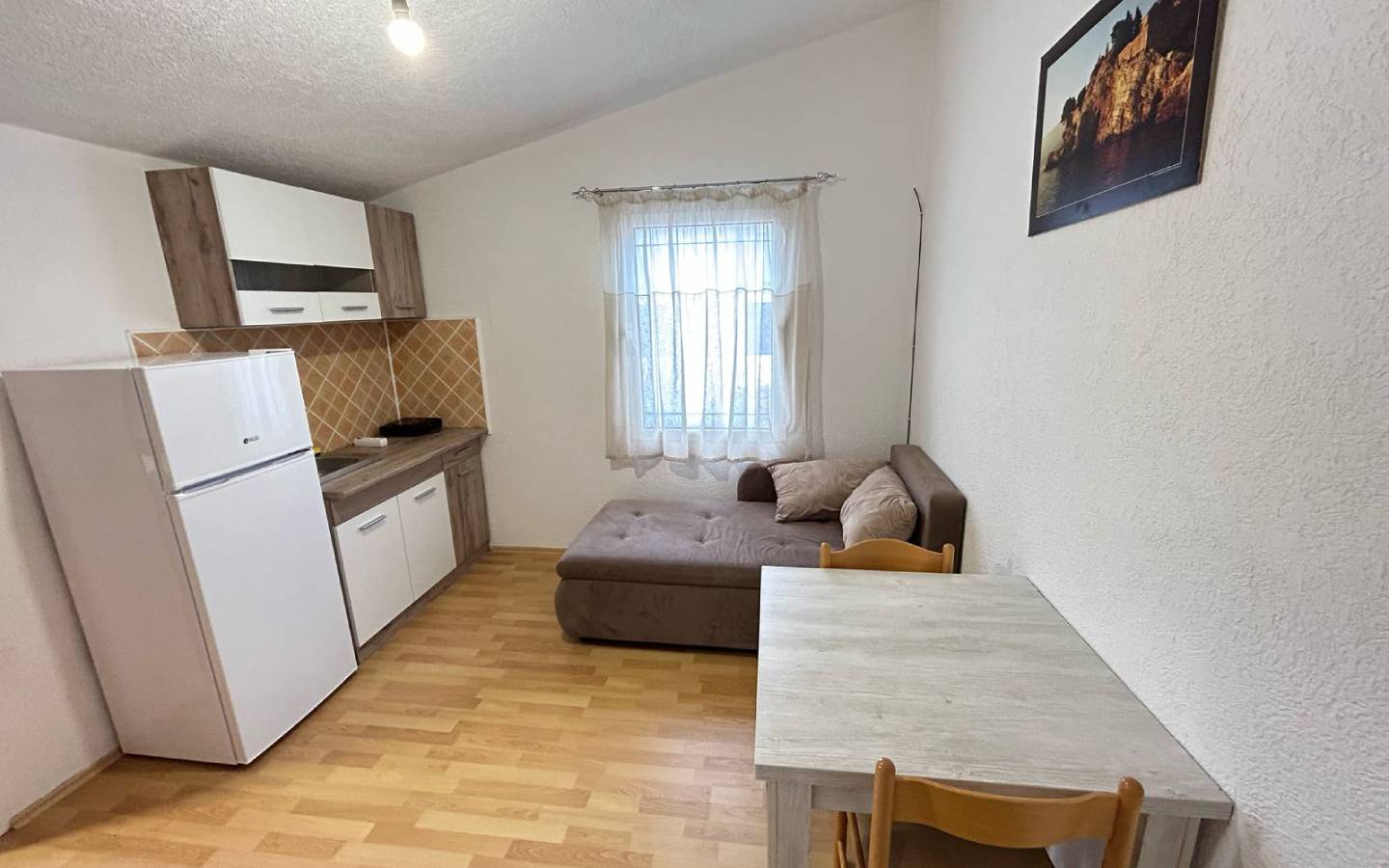 Bright kitchen-living space with wood floors, quality furnishings in Ulcinj&mdash;prime investment from immobilien.ekosphere.me by Ekosphere.