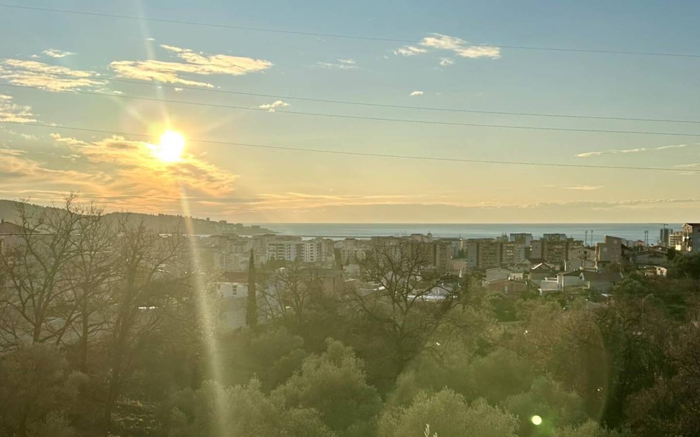 Stunning Ulcinj real estate: modern apartments, lush greenery, and sea views at sunset. Exclusive listing by ekosphere doo.