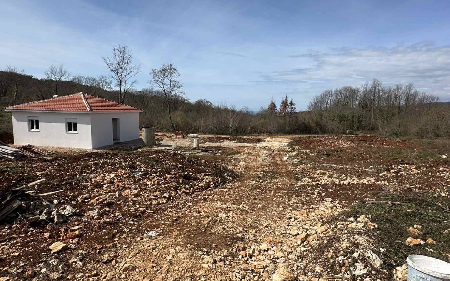 Charming white single-story house with red-tiled roof on a cleared plot in Ulcinj, Montenegro&mdash;ideal property investment. By ekosphere doo.