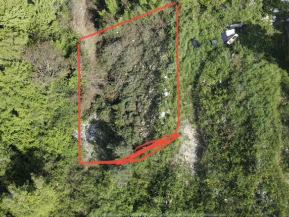Prime real estate plot in Ulcinj, Montenegro&mdash;outlined area amid lush greenery. Investment potential via immobilien.ekosphere.me (ekosphere doo).