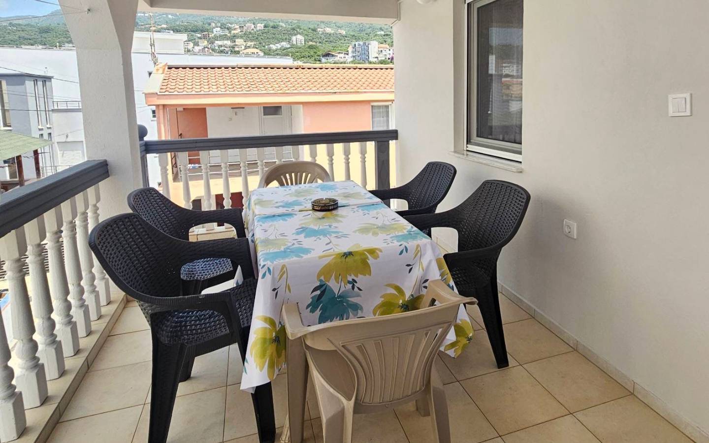 Spacious covered balcony in Ulcinj: table, six chairs. Ideal for relaxing or investors. Montenegro-listings.me by Ekosphere doo.