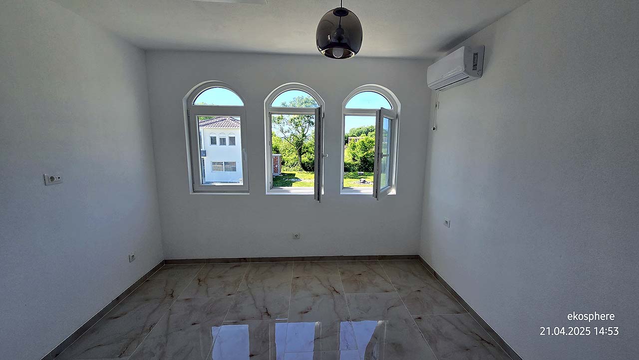 Bright, investment-ready room in Ulcinj, Montenegro with arched windows, views, AC; exclusive to immobilien.ekosphere.me by ekosphere doo.