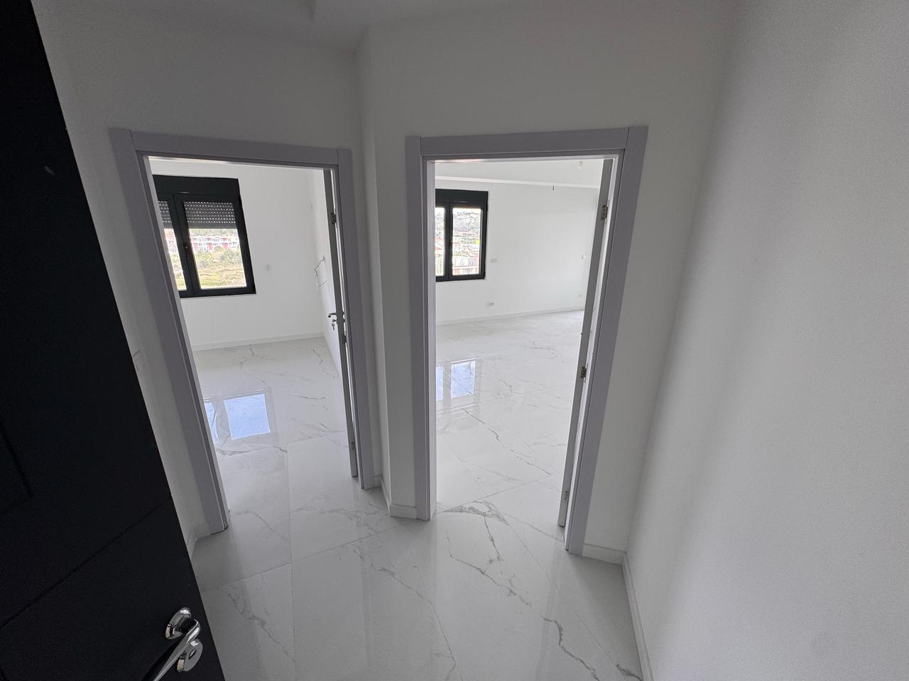 Spacious Ulcinj property: sunlit rooms, modern white interiors, glossy tile floors&mdash;exclusive at immobilien.ekosphere.me by Ekosphere.