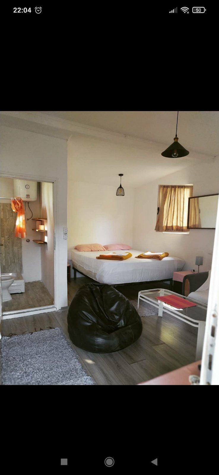 Bright Ulcinj bedroom with double bed, wood floors, and bath access&mdash;ideal Montenegro property by Ekosphere on immobilien.ekosphere.me.