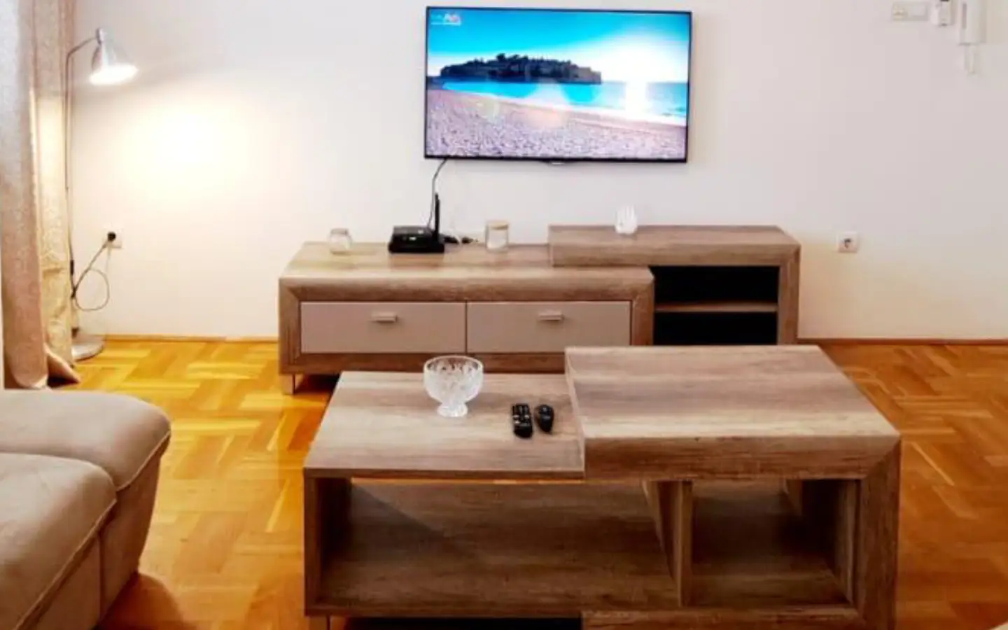Stunning Ulcinj Montenegro property: modern living room, sleek TV, stylish wood accents, ideal investment by ekosphere doo on immobilien.ekosphere.me.