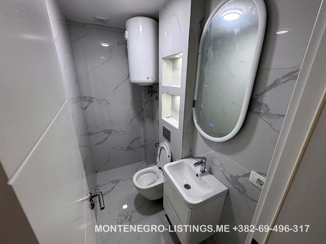 Modern bathroom with sink and toilet, ideal for Ulcinj property investment. On immobilien.ekosphere.me by ekosphere doo.