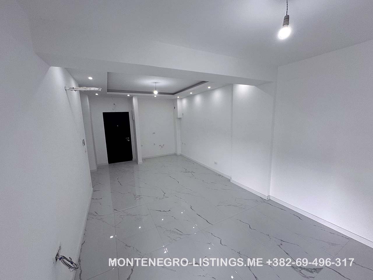 Stunning modern white space with glossy floors and recessed lights&mdash;perfect Ulcinj, Montenegro real estate. immobilien.ekosphere.me by Ekosphere doo.