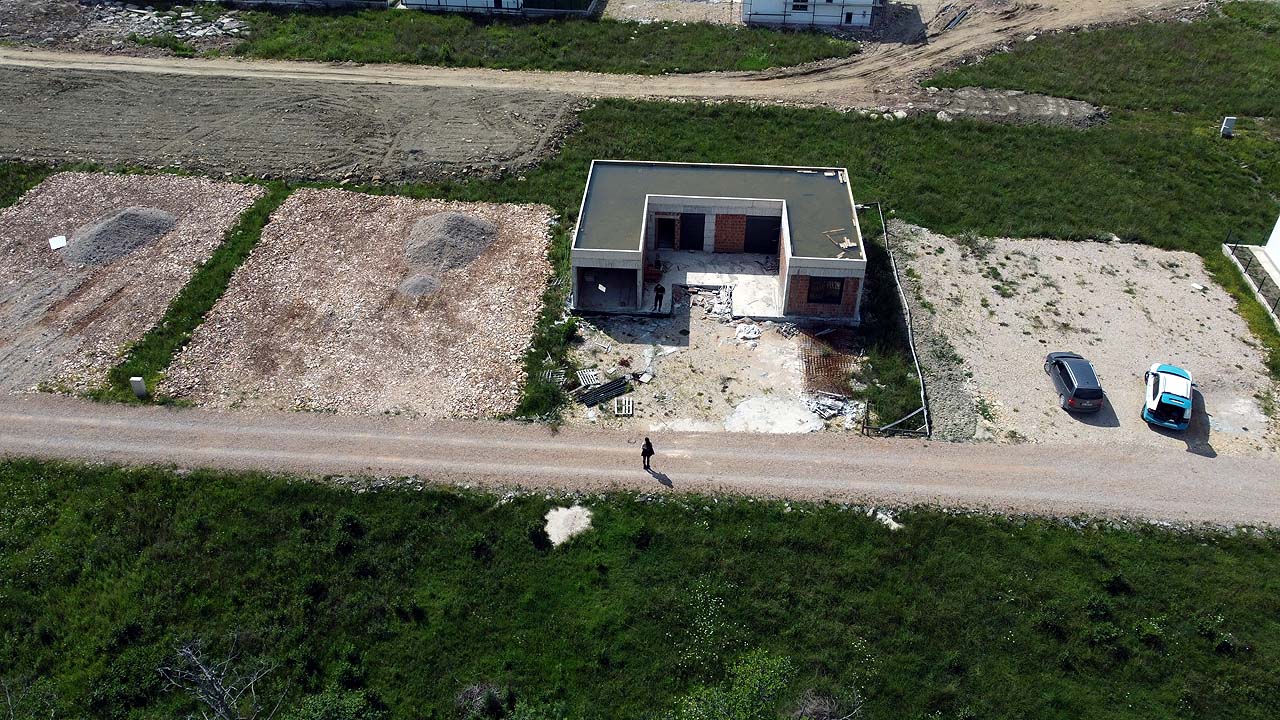Prime investment opportunity: aerial of unfinished house on spacious Ulcinj lot, great ROI. Montenegro-Listings.me by Ekosphere DOO.
