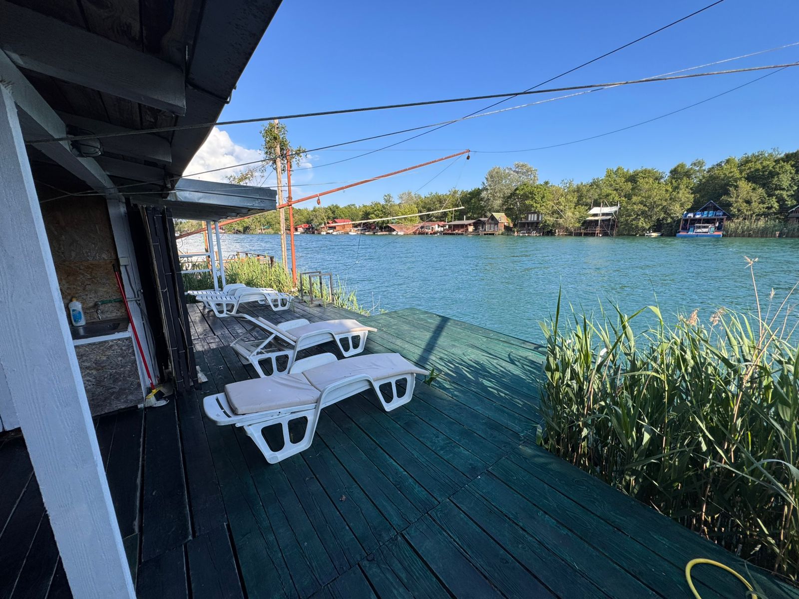 Luxury wooden deck with lounge chairs, river views, and prime Ulcinj real estate. Invest in Montenegro-listings.me by ekosphere doo.