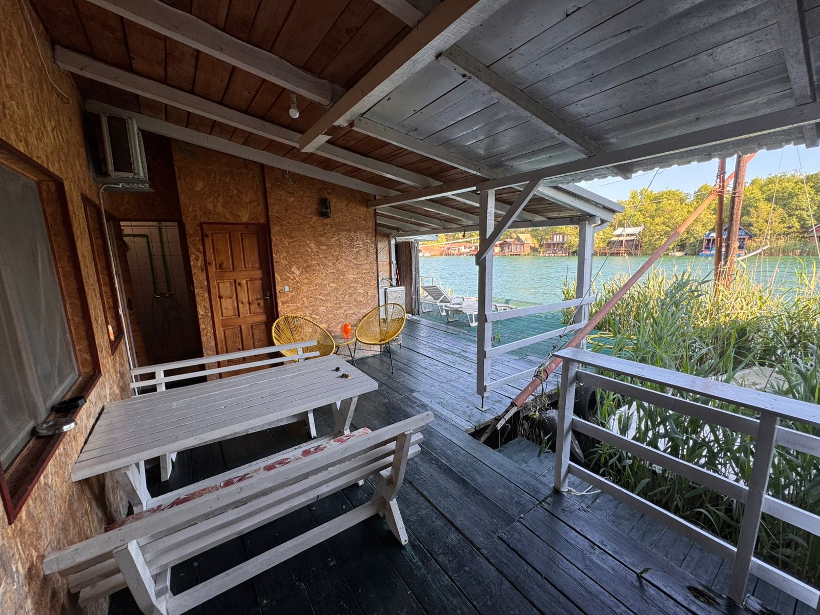 Experience Ulcinj luxury&mdash;covered deck, water views, modern seating. Prime investment at immobilien.ekosphere.me by Ekosphere DOO.