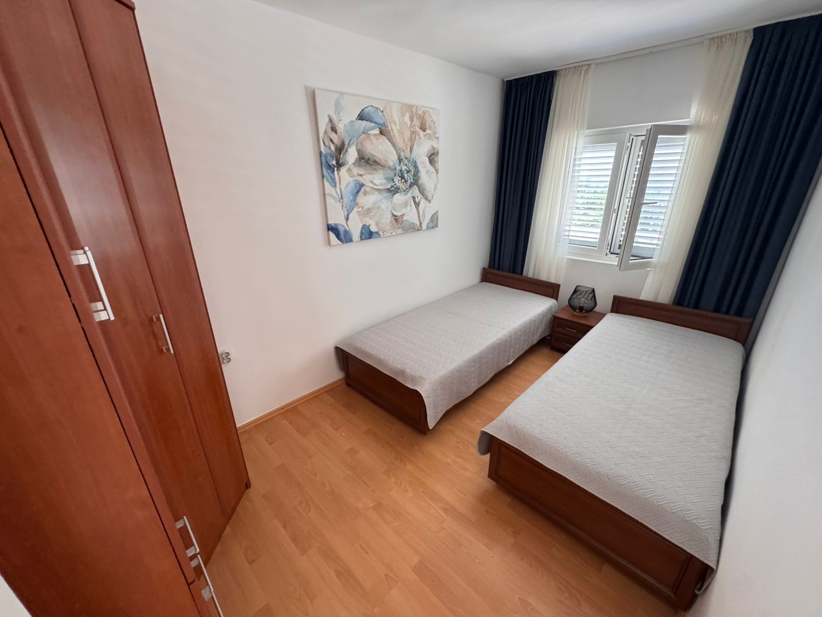 Charming Ulcinj bedroom with twin beds, stylish decor and ample storage&mdash;ideal Montenegro investment from ekosphere doo at immobilien.ekosphere.me.