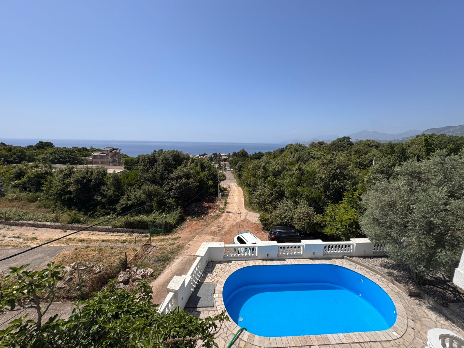 Stunning Ulcinj villa with blue pool, sea views, and lush greenery&mdash;prime Montenegro real estate from ekosphere doo on immobilien.ekosphere.me.