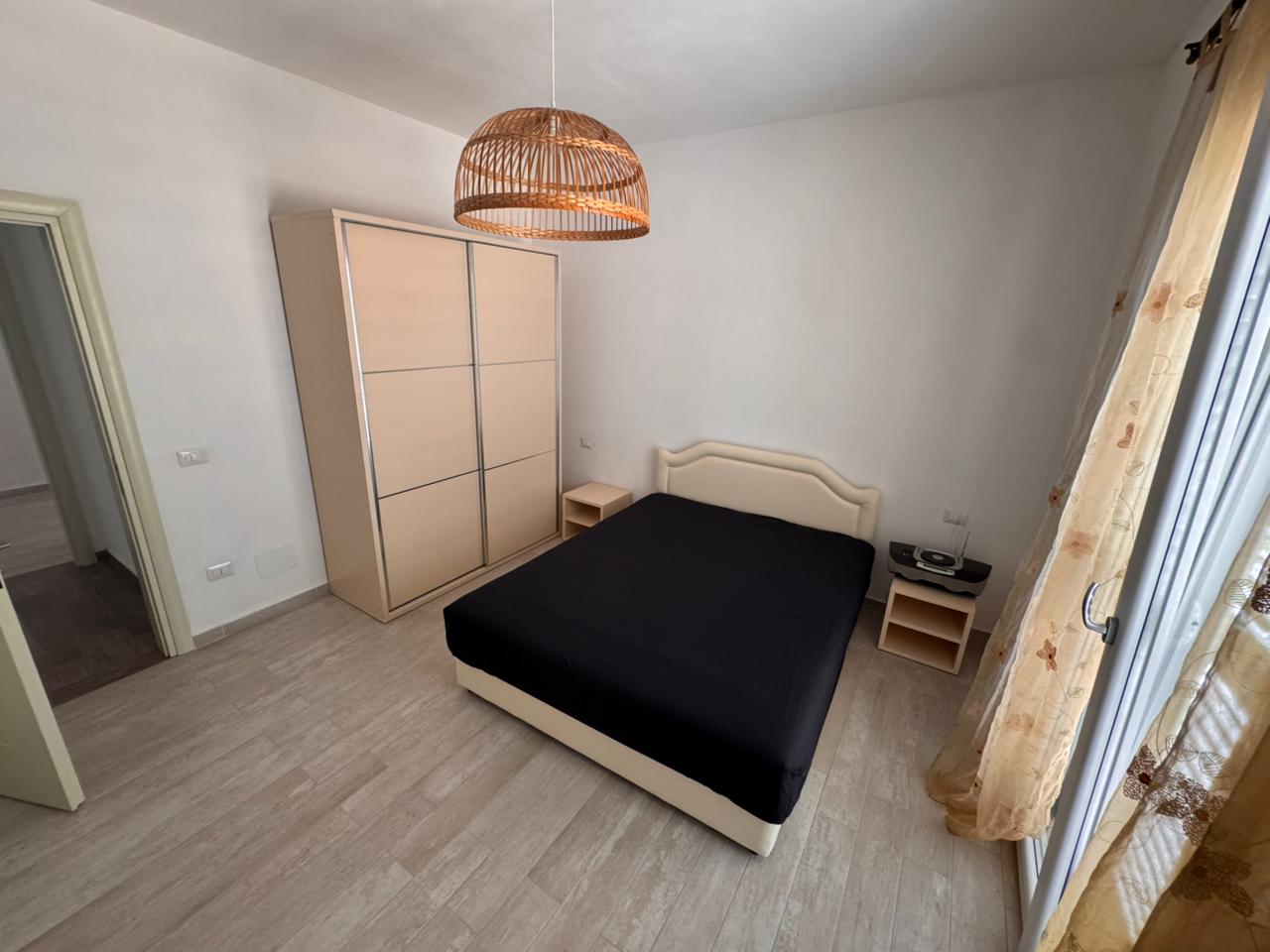Modern Ulcinj bedroom with stylish double bed, chic decor, and balcony&mdash;exclusive property by immobilien.ekosphere.me (ekosphere doo).