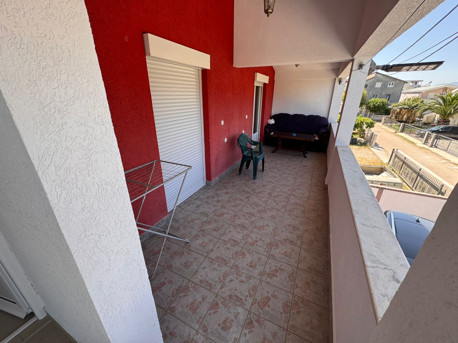 Spacious tiled balcony in Ulcinj with stylish seating, city views&acirc;prime investment via immobilien.ekosphere.me by Ekosphere doo.