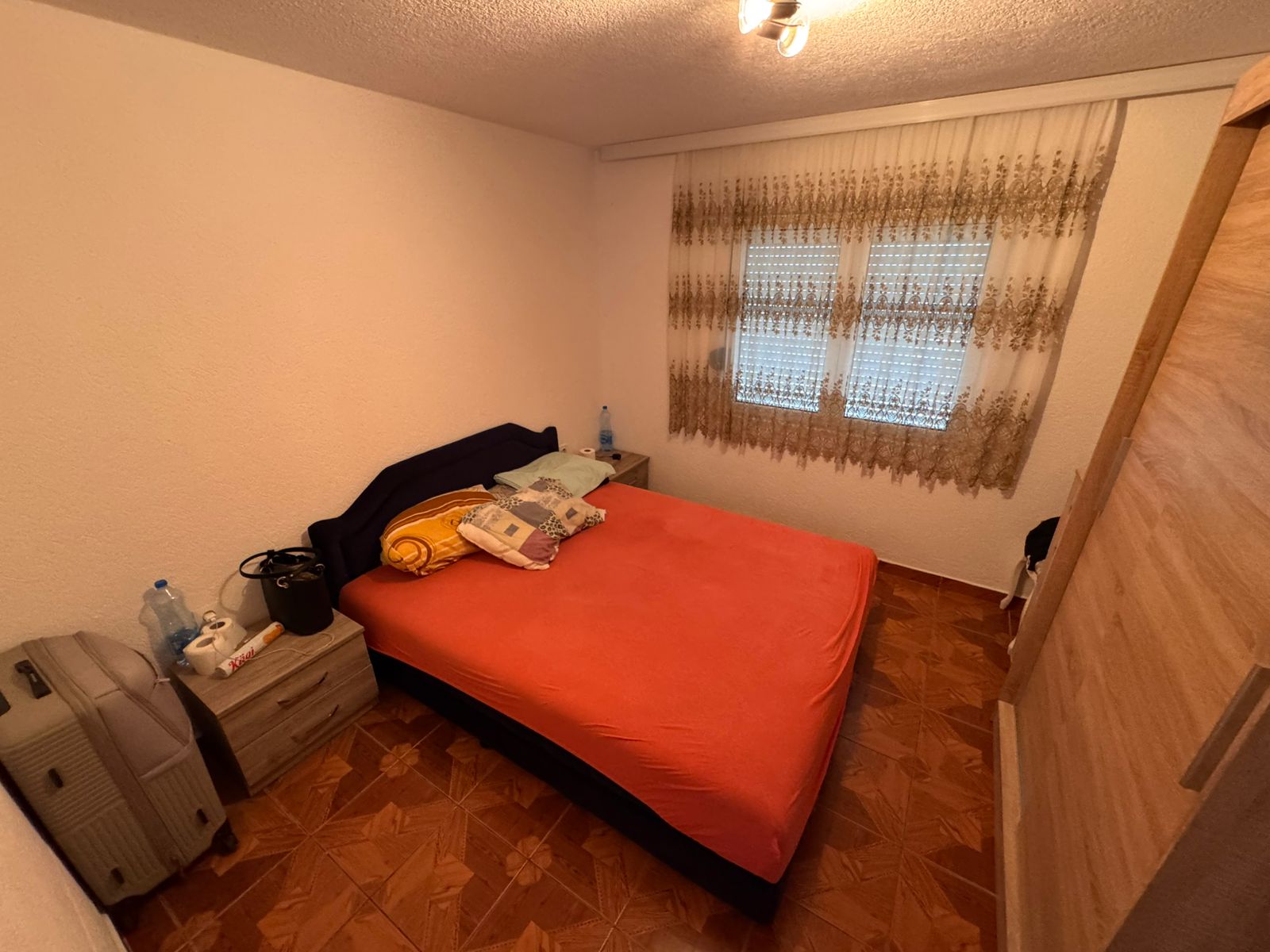 Charming Ulcinj bedroom with double bed, bright linens, and wood wardrobe&acirc;ideal Montenegro investment via immobilien.ekosphere.me/Ekosphere.