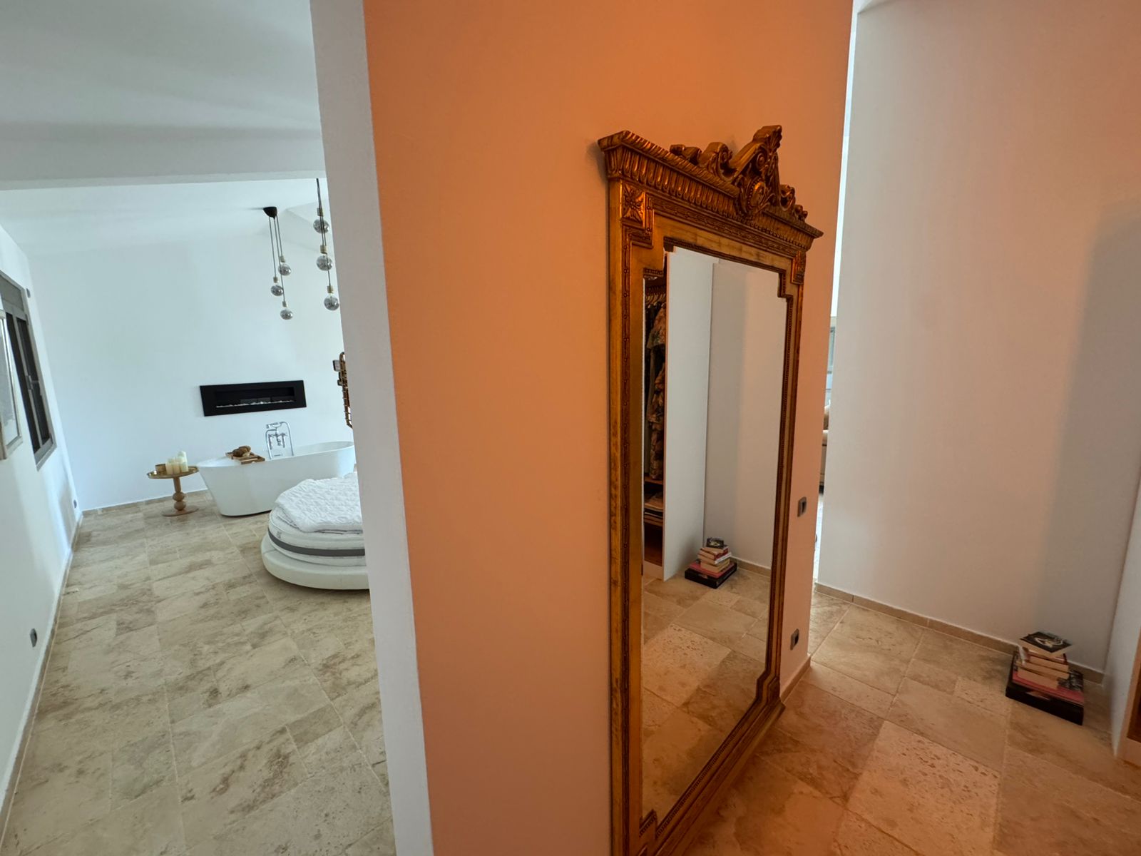 Elegant hallway with beige tiles, gold mirror, and a stylish living area&mdash;your Ulcinj real estate dream on immobilien.ekosphere.me by ekosphere doo.