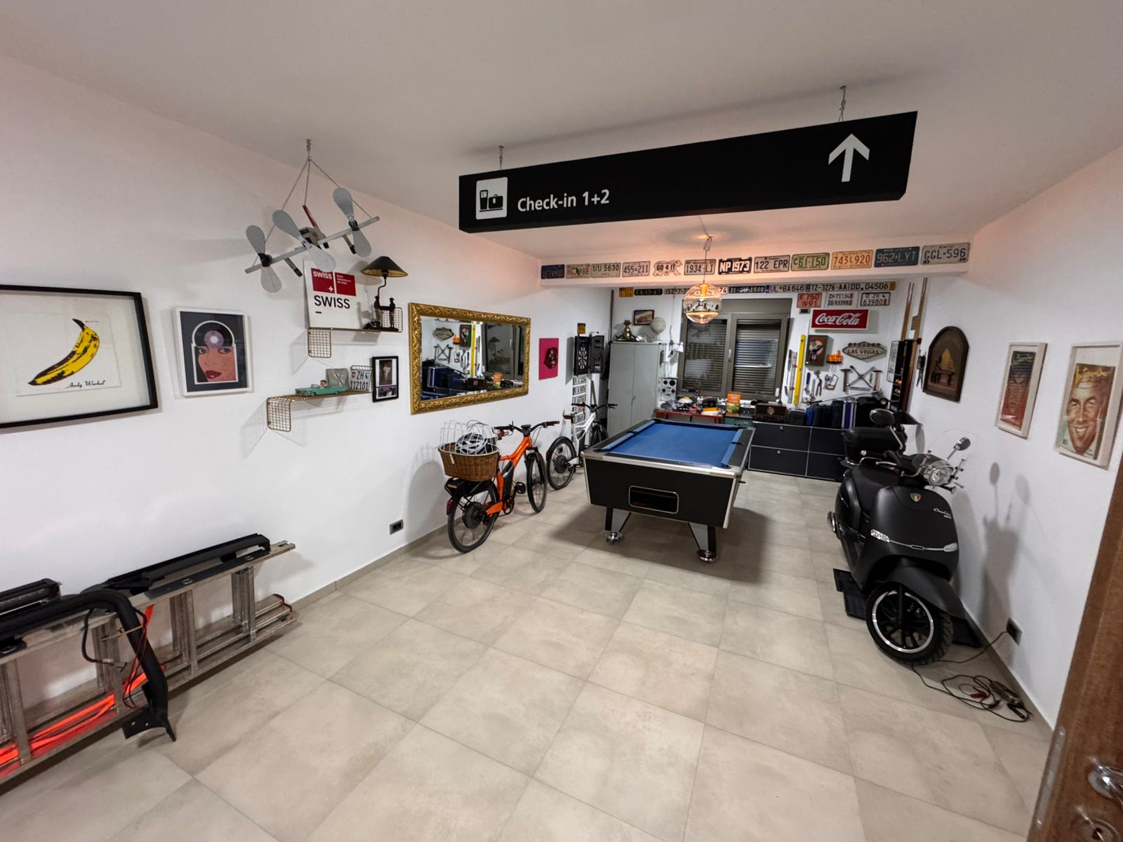 Stylish Ulcinj room with pool table, art, scooter, and d&eacute;cor&mdash;unique Montenegro real estate by Ekosphere on immobilien.ekosphere.me.