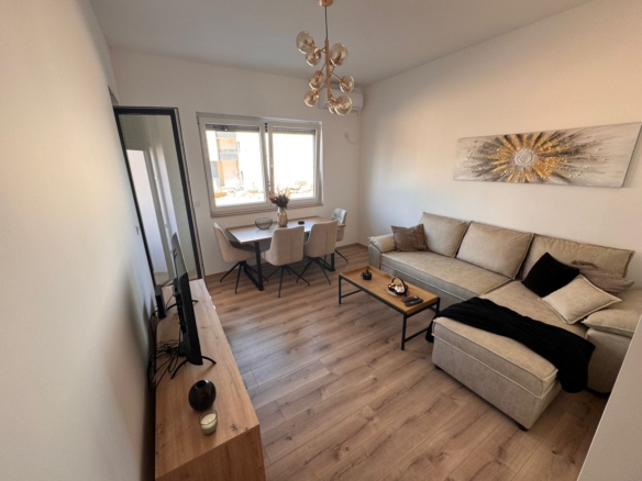 Elegant modern living room in Ulcinj with light wood floors and chic decor&mdash;exclusive Montenegro-listings.me property by Ekosphere DOO.