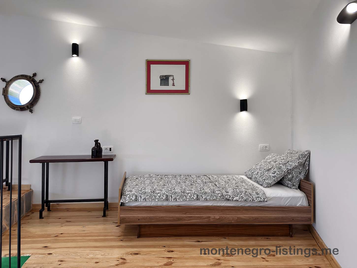 Chic Ulcinj, Montenegro bedroom with wood bed, stylish decor, warm floors&mdash;prime real estate on immobilien.ekosphere.me by Ekosphere.