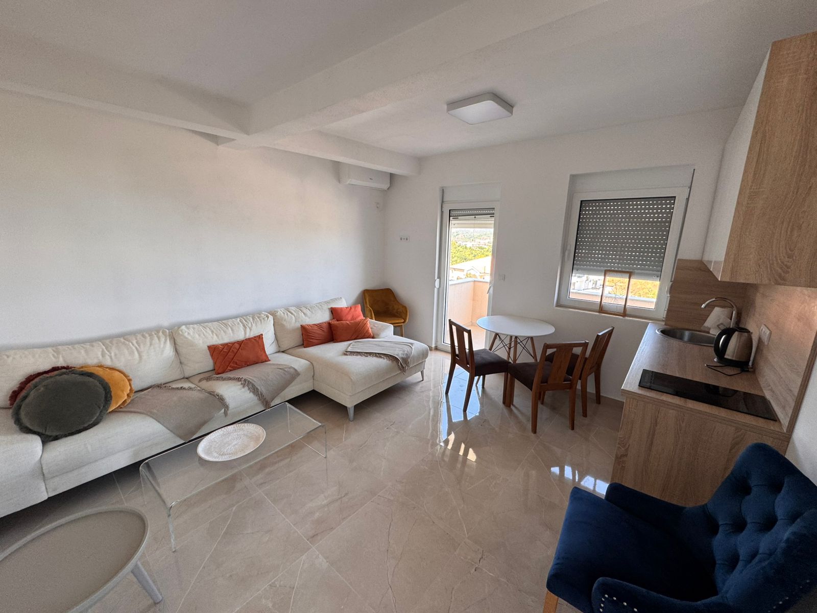 Stunning Ulcinj apartment: bright modern living, white sectional, designer kitchen by ekosphere doo. Invest in Montenegro property now!.