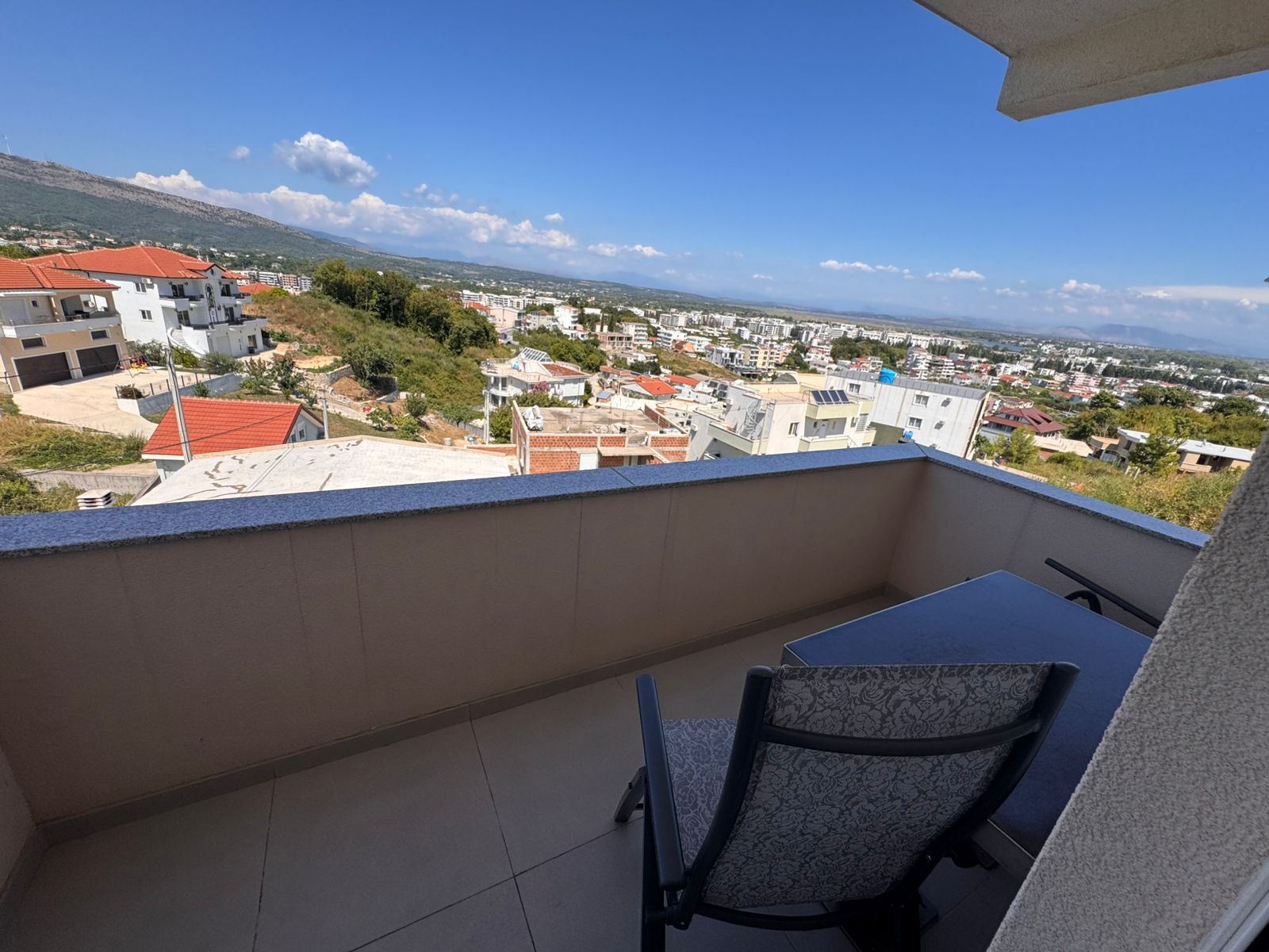 Stunning balcony view in Ulcinj, Montenegro&mdash;overlooking prime real estate amid greenery and hills; listed on immobilien.ekosphere.me by Ekosphere doo.
