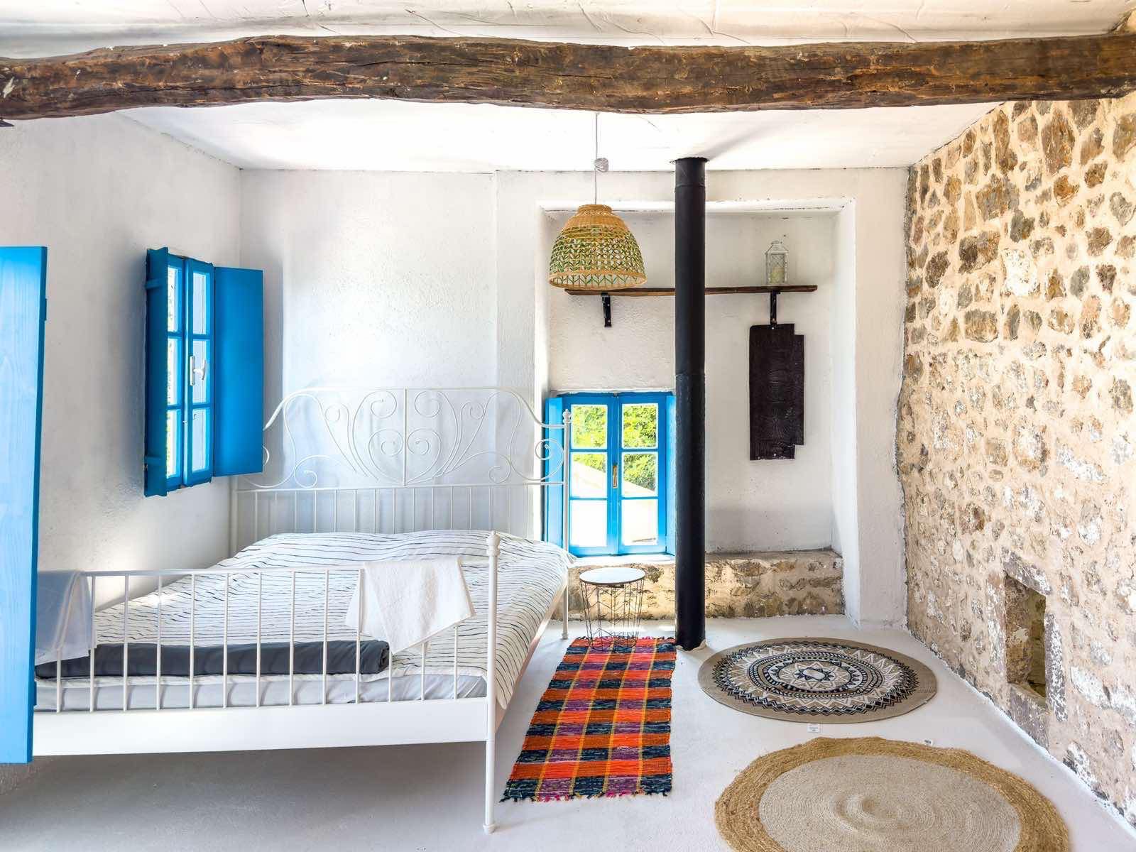 Real Estate Financing Charming rustic bedroom in Ulcinj, stone accents, sunlit windows & premium finishes&mdash;exclusive on immobilien.ekosphere.me by ekosphere doo.