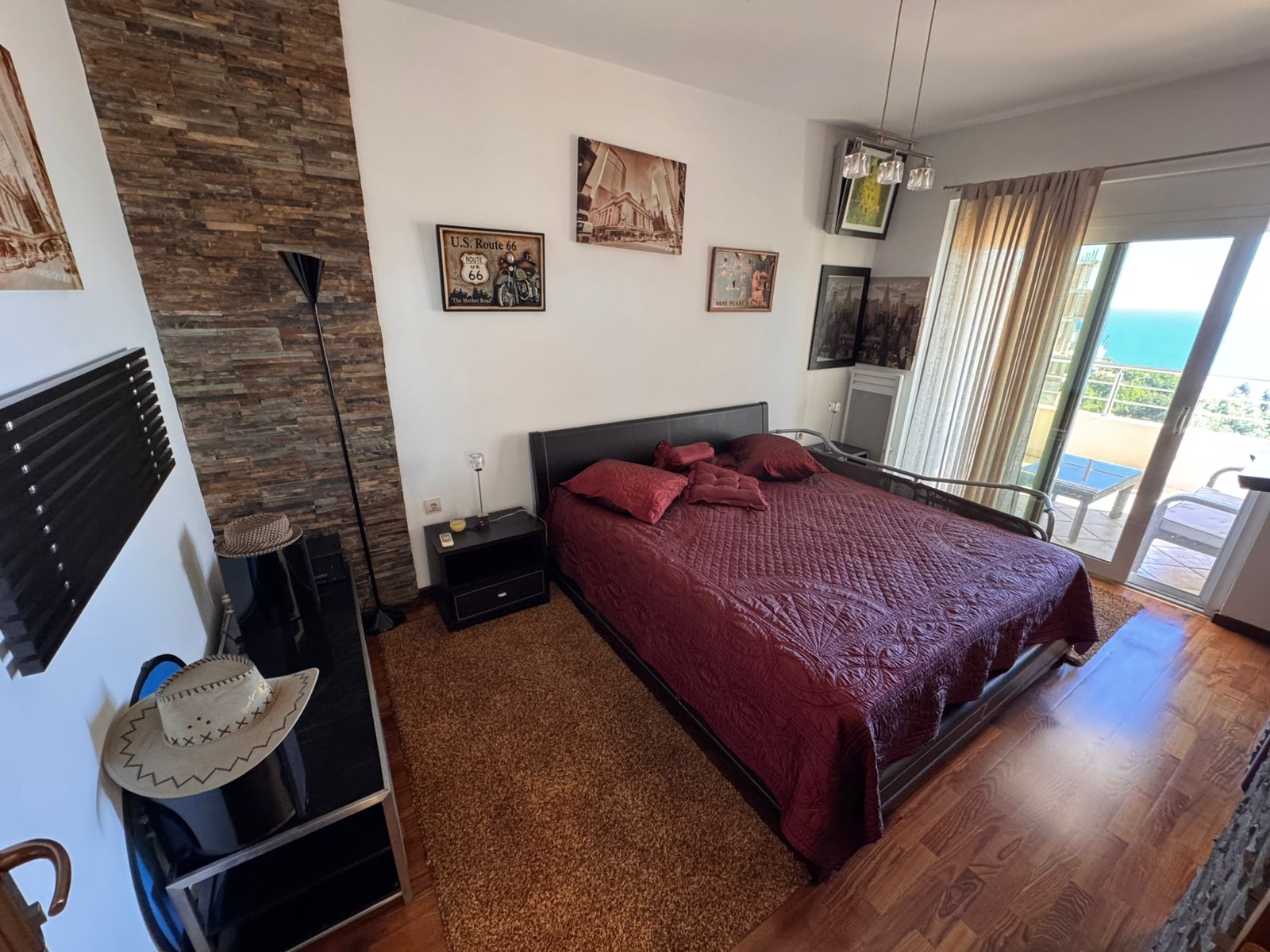 Modern Ulcinj bedroom with sea-view balcony, quality wood floors, elegant double bed&mdash;ideal Montenegro investment at immobilien.ekosphere.me.