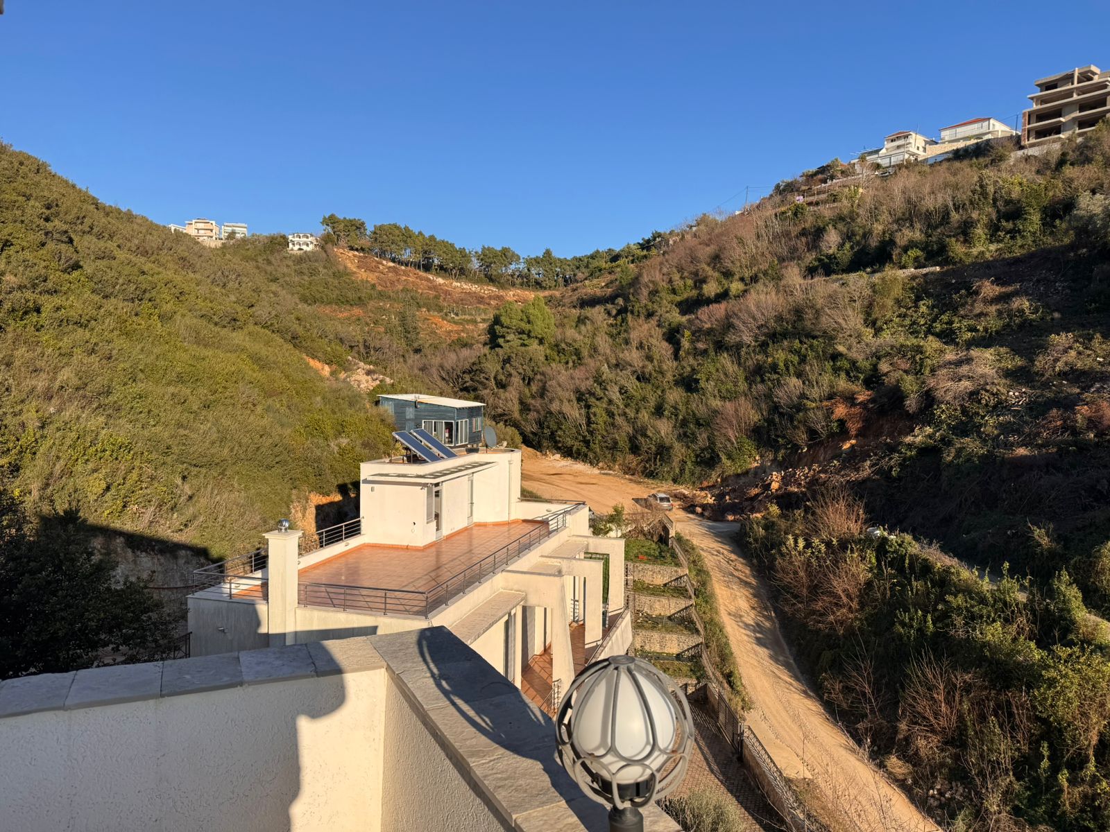 Stunning Ulcinj hillside property with modern homes, lush greenery, and panoramic views&mdash;prime real estate from ekosphere doo.