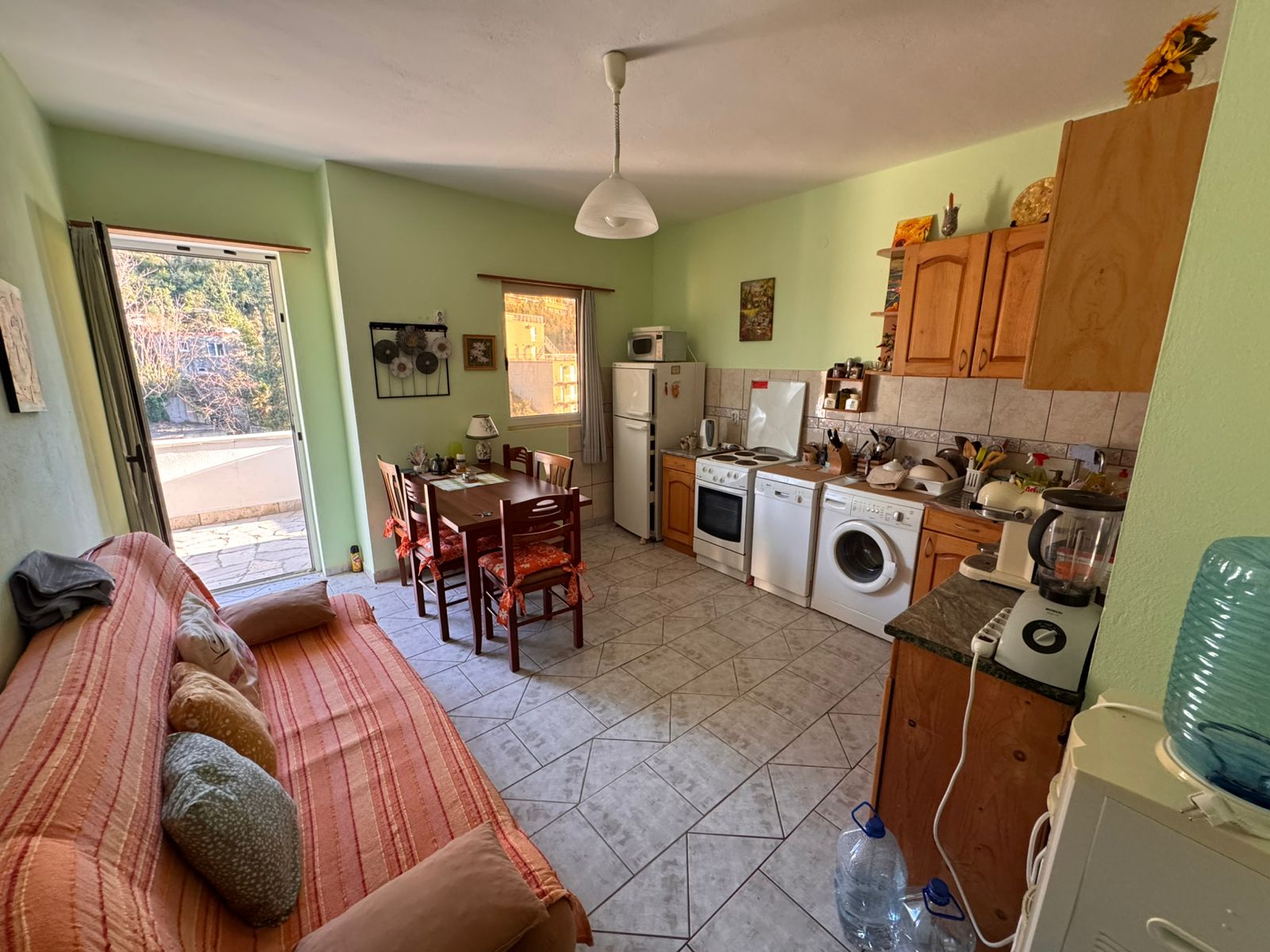 Charming Ulcinj apartment: modern kitchen, stylish dining area, balcony access&mdash;ideal investment on immobilien.ekosphere.me by ekosphere doo.