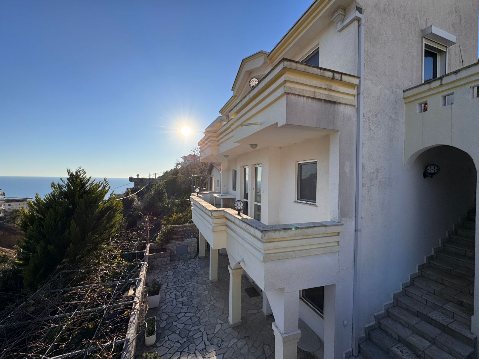 Elegant two-story white villa in Ulcinj with sea views, balconies, stone patio&mdash;prime investment via immobilien.ekosphere.me by ekosphere doo.