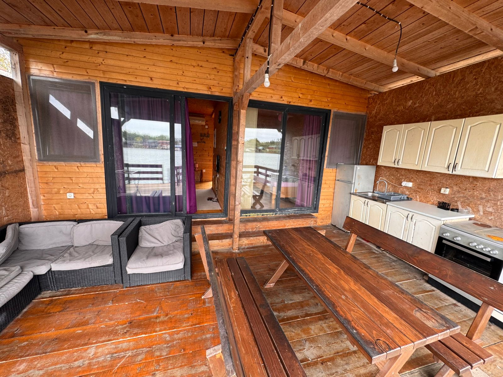 Stunning covered patio in Ulcinj with water views, modern kitchenette, stylish outdoor seating&mdash;ideal Montenegro investment. Eksosphere doo.