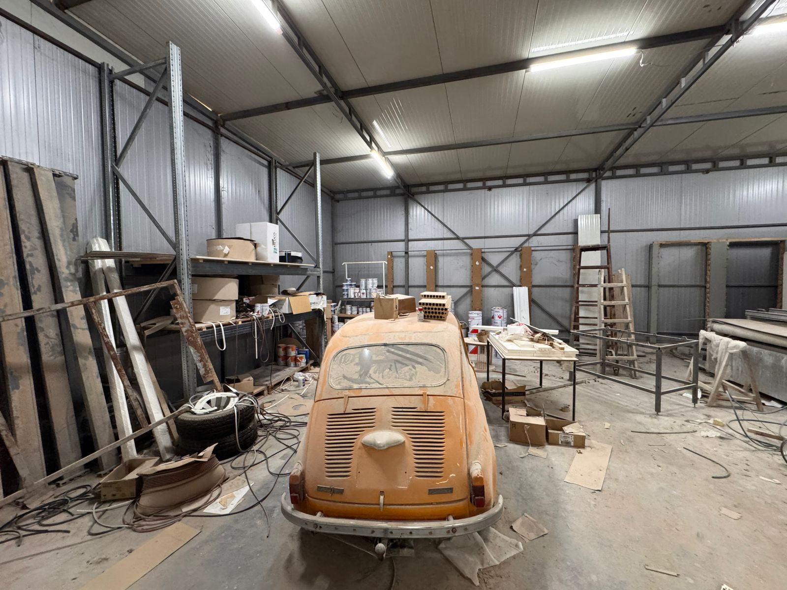 Spacious Ulcinj workshop in Montenegro, ideal for renovation. Includes metal walls, ample shelves, and investment potential.