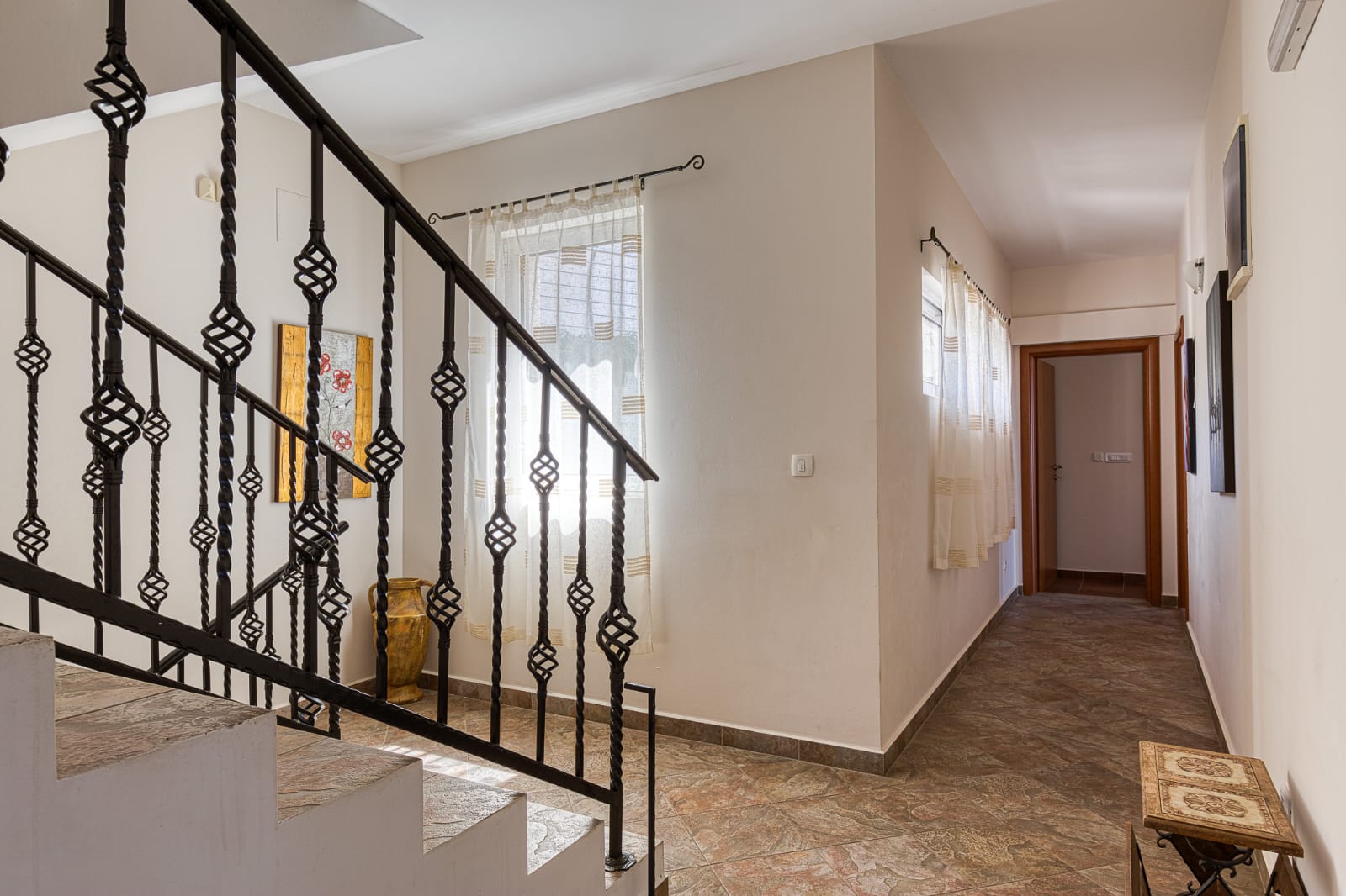Elegant hallway with tiled floors, decorative staircase, and modern finishes&mdash;prime Ulcinj investment by ekosphere doo at immobilien.ekosphere.me.