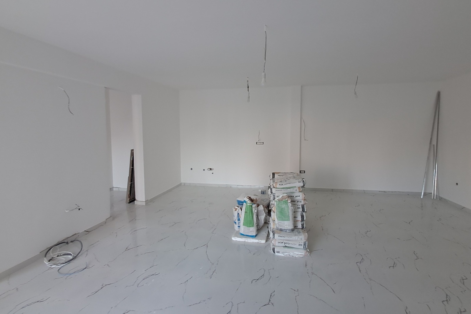 Spacious Ulcinj property under renovation with white walls, stylish flooring, and investment potential&mdash;immobilien.ekosphere.me by ekosphere doo.